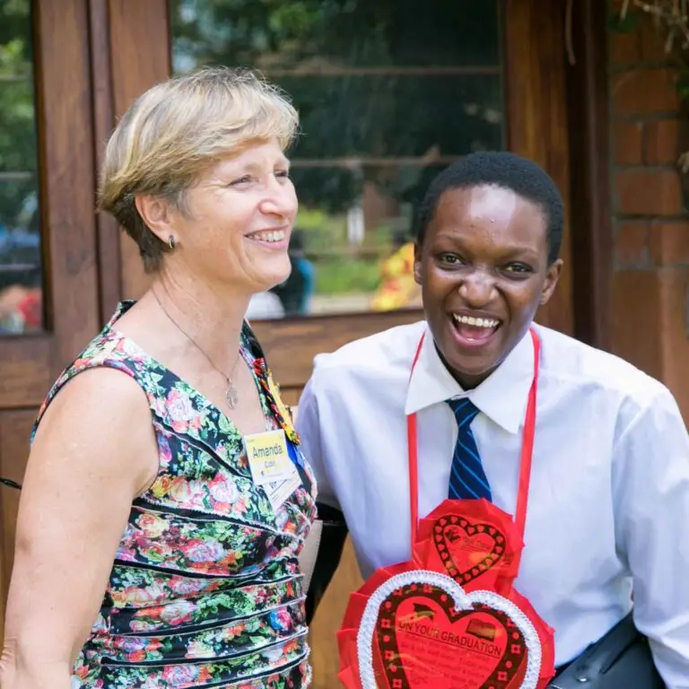 Visitors - Graduation - Sponsor with student laughing