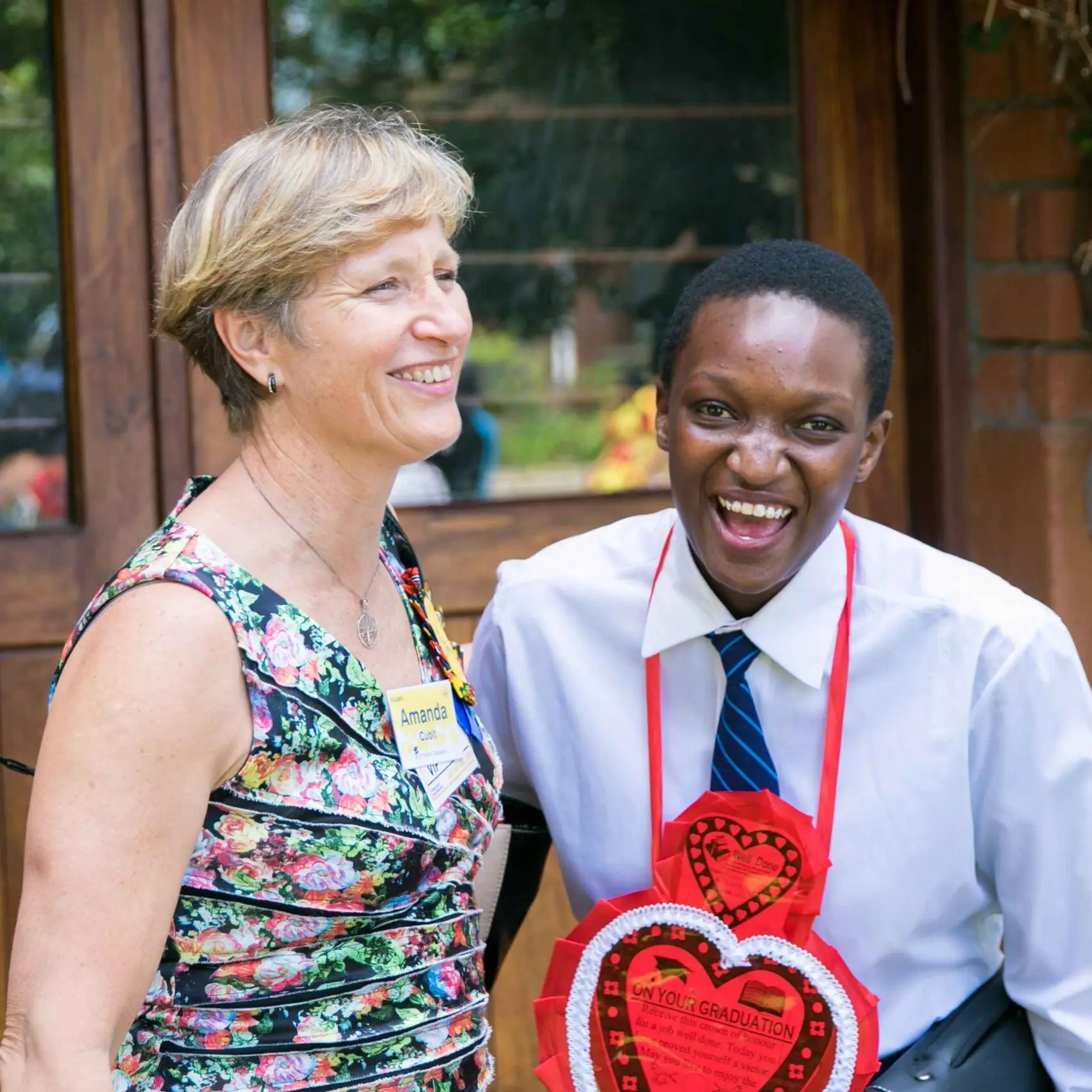 Visitors Graduation Sponsor with student laughing scaled e1778599139796