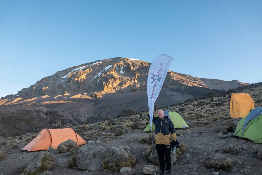 Standing at the roof of Mt. Kilimanjaro, the world's highest free standing mountain is an unforgettable experience.