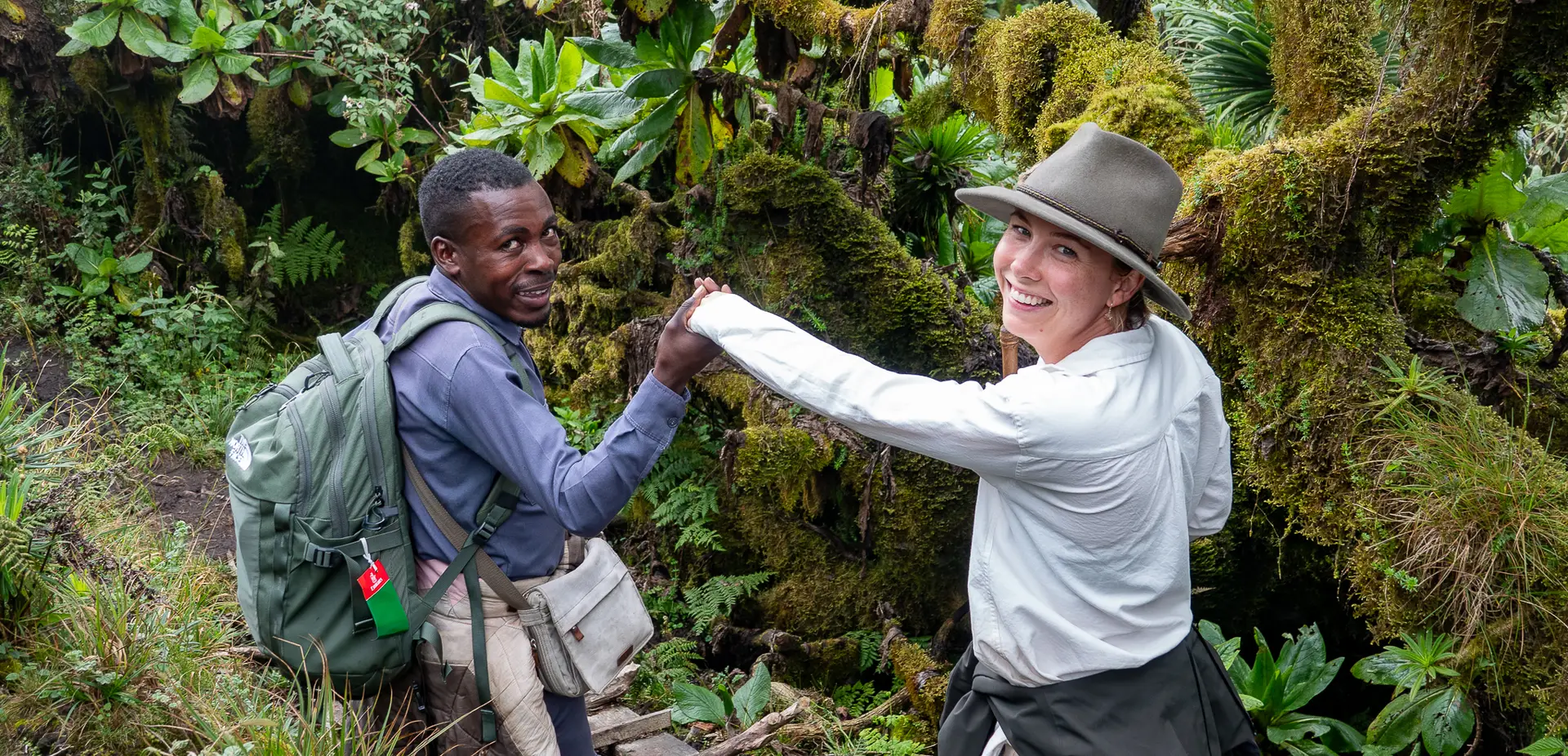 An AOL trekker at Mt. Sabyinyo located at the boarder of Uganda, Rwanda and Democratic Republic of Congo.