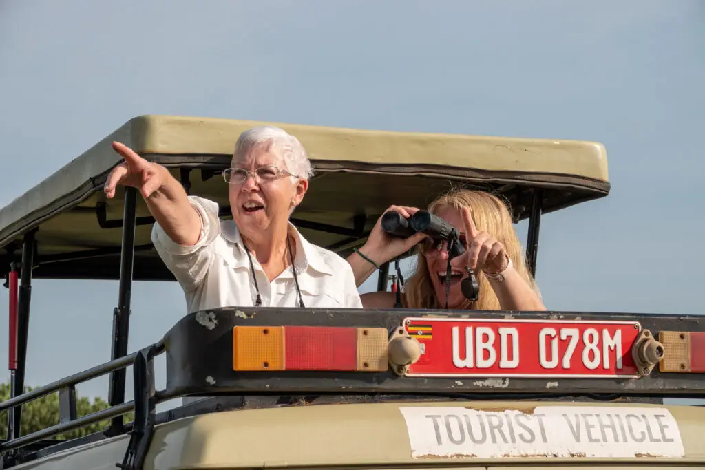 Spotting Africa's big 5 on safari, Uganda, Africa.