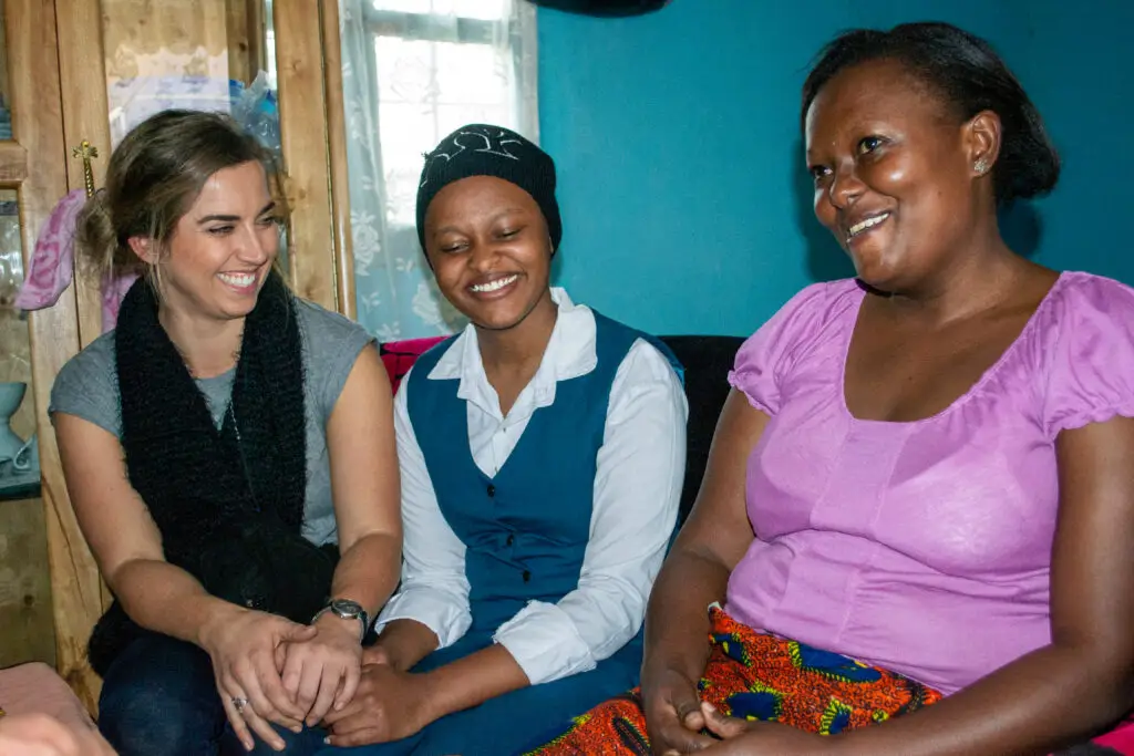 Responsible tourism. A home visit by an AOL traveler to her sponsor student's home in Arusha, Tanzania