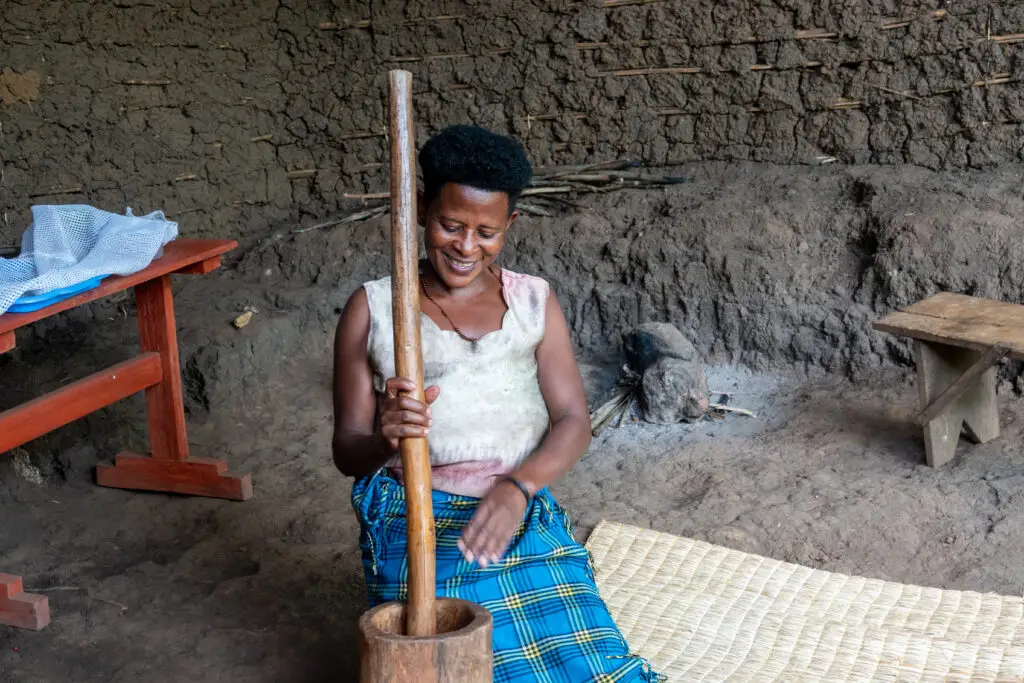 A woman demonstrates the preparation of a traditional delicacy in Kibale commmunity, Uganda.