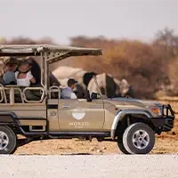 Top Namibia Safaris and Tours 9 driving through namibia on safari in a jeep